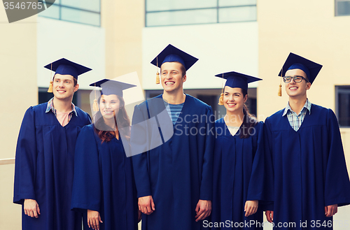 Image of group of smiling students in mortarboards