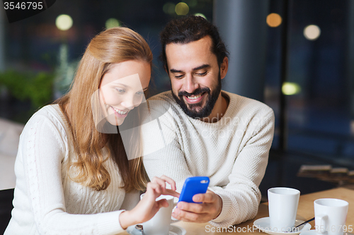 Image of happy couple with tablet pc and coffee at cafe