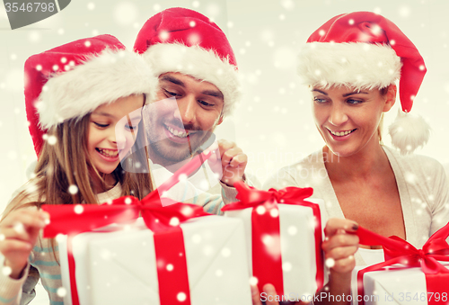 Image of happy family sitting on couch at home