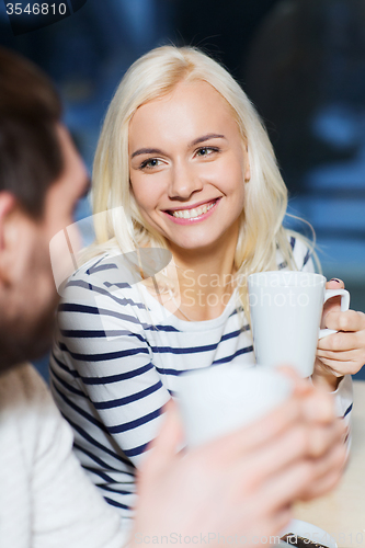 Image of happy couple meeting and drinking tea or coffee