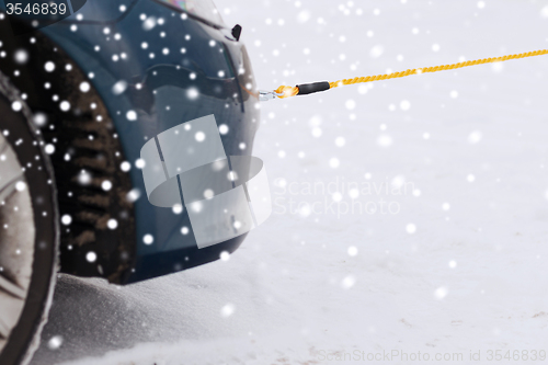 Image of closeup of towed car with towing rope