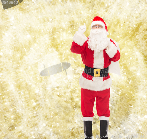 Image of man in costume of santa claus with bag