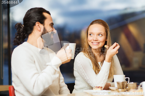 Image of happy couple meeting and drinking tea or coffee