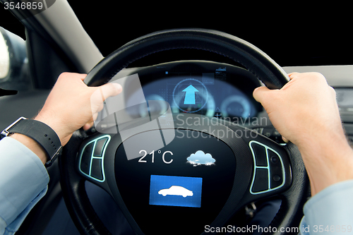 Image of close up of man driving car with weather sensor