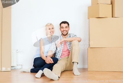 Image of couple with cardboard boxes moving to new home