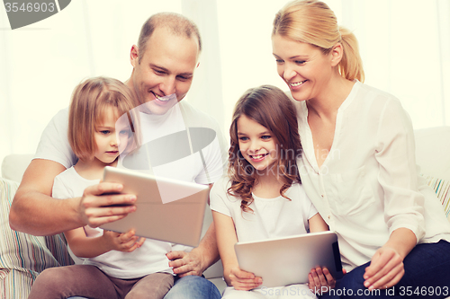 Image of family and two kids with tablet pc computers