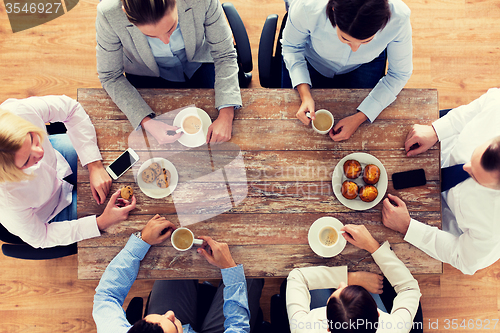Image of close up of business team drinking coffee on lunch