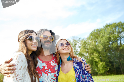 Image of smiling young hippie friends outdoors