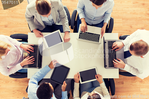 Image of business team with laptop and tablet pc