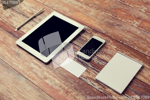 Image of close up of notebook, tablet pc and smartphone