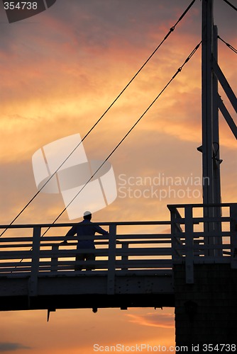 Image of Man watching sunset