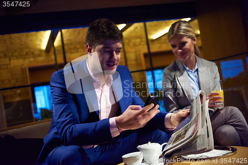 Image of business couple take drink after work