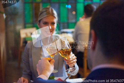 Image of business couple having dinner