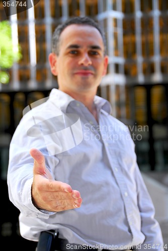 Image of Businessman offering hand