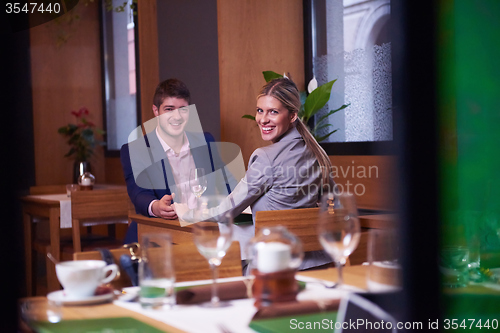 Image of business couple having dinner