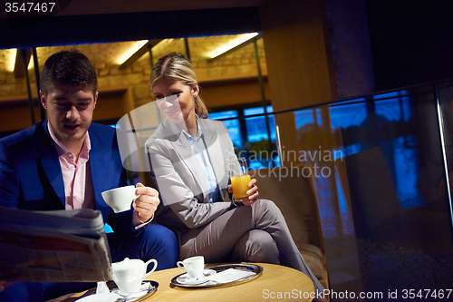 Image of business couple take drink after work