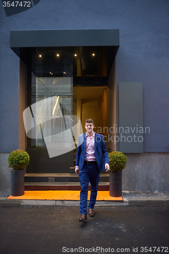 Image of business man entering  hotel