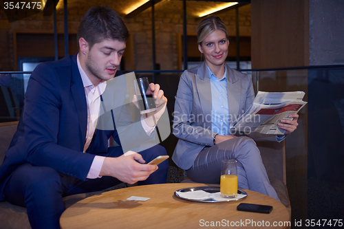 Image of business couple take drink after work