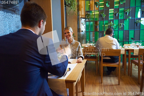 Image of business couple having dinner