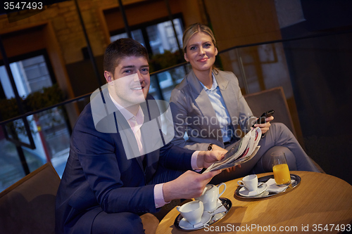 Image of business couple take drink after work