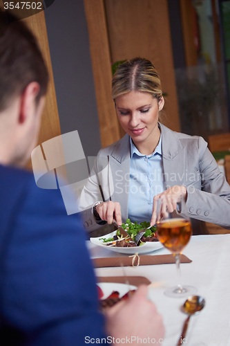 Image of business couple having dinner