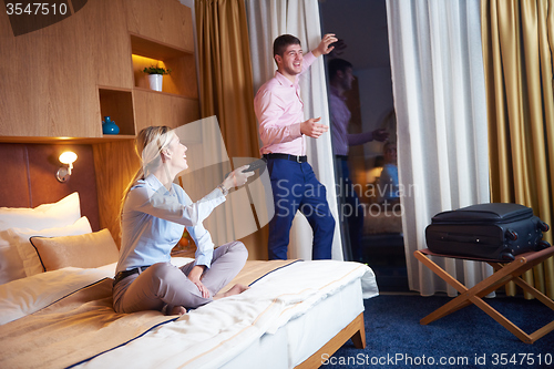 Image of young couple in modern hotel room