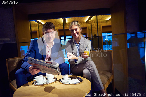 Image of business couple take drink after work