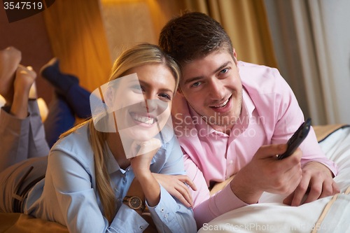 Image of young couple in modern hotel room