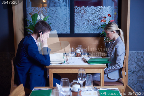 Image of business couple having dinner