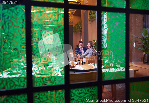 Image of business couple having dinner