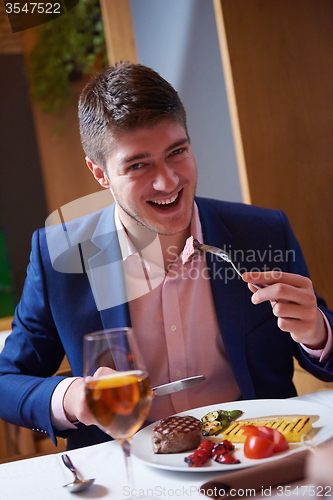 Image of business couple having dinner