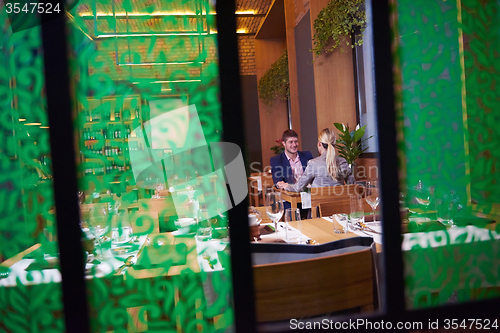 Image of business couple having dinner