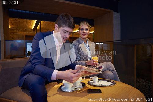 Image of business couple take drink after work