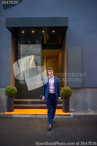 Image of business man entering  hotel