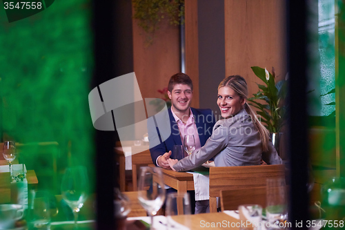 Image of business couple having dinner