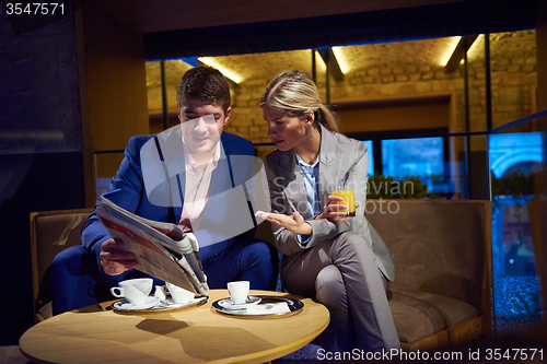 Image of business couple take drink after work