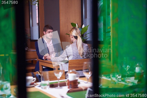 Image of business couple having dinner