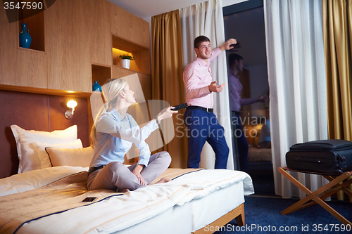 Image of young couple in modern hotel room