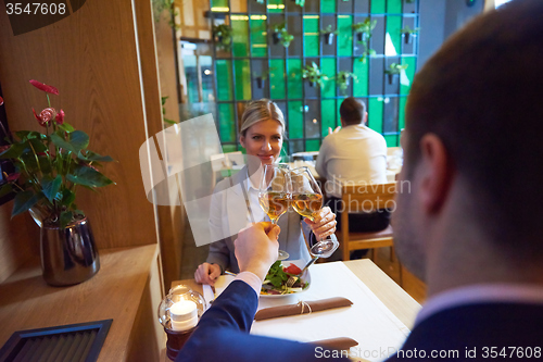 Image of business couple having dinner