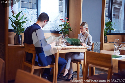 Image of business couple having dinner