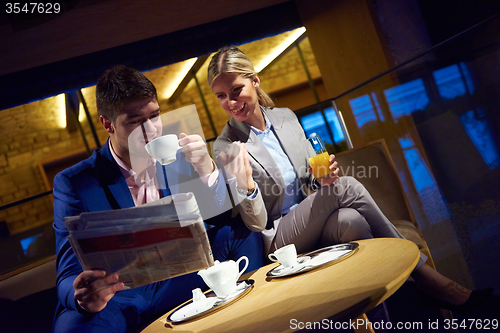 Image of business couple take drink after work