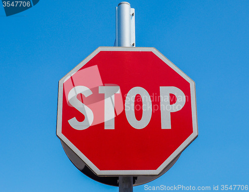 Image of Stop sign over blue sky