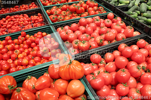 Image of red tomatoes and cucumbers on the counter