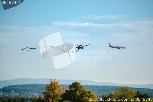 Image of Kite and airplane