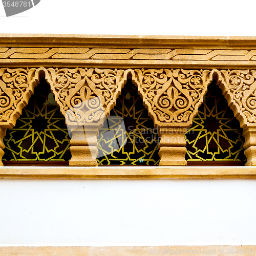 Image of   yellow window in morocco africa old construction and brown wal