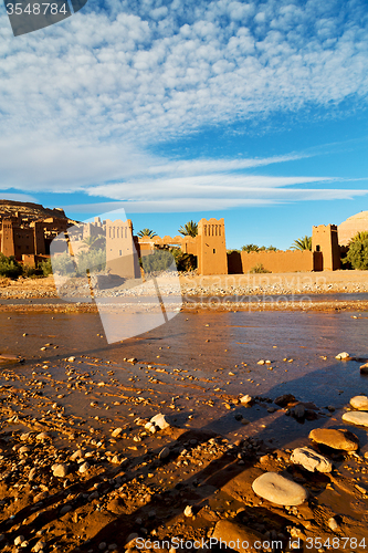 Image of   in africa old construction near the river blue