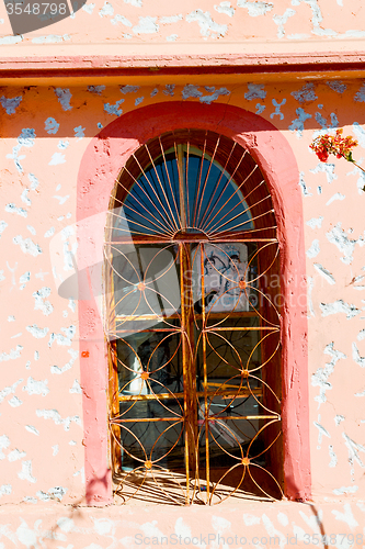 Image of   window in morocco africa and brown wall  