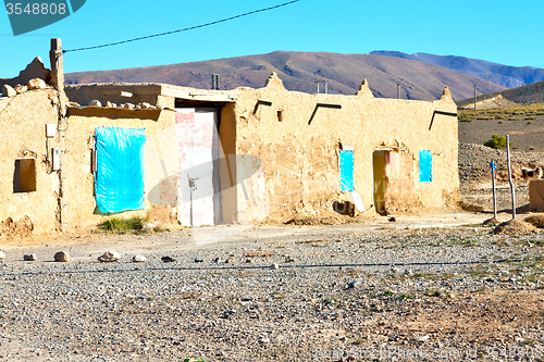 Image of brown construction   in    valley  morocco         atlas dry mou