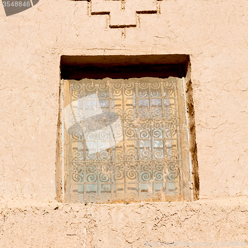 Image of   window in morocco africa old construction and brown wall  