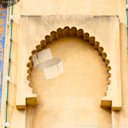 Image of   yellow window in morocco africa old construction and brown wal